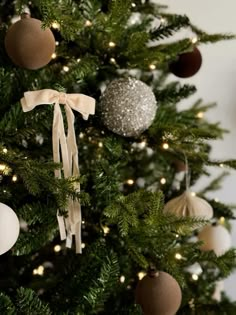 a christmas tree with ornaments hanging from it