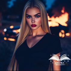 a woman with long blonde hair is standing in front of a fire and car at night