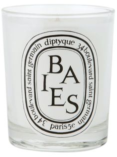 a glass candle with the words baes printed on it