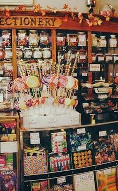 a store filled with lots of different types of candies and lollipops