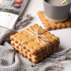 two waffles wrapped in twine on a table