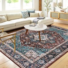 a living room filled with furniture and a large rug