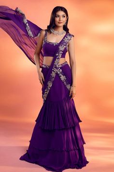 Purple pre-draped layered lehenga saree, with attached cancan, silver floral embroidery on the drape. Comes with floral embroidered padded blouse.
Components: 2
Pattern: Embroidered
Type Of Work: Floral
Neckline: Square
Sleeve Type: Sleeveless
Fabric: Georgette
Color: Purple
Other Details: 
Attached lining
Approx. product weight: 1-2 Kgs
Occasion: Destination Wedding - Aza Fashions Drape Lehenga, Sari Lehenga, Lehenga Designs Simple, Gaun Fashion, Saree Designs Party Wear, Indian Dresses Traditional, Traditional Indian Outfits, Indian Gowns, Indian Bridal Outfits