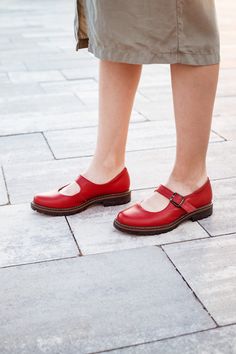 "Our red Mary Janes shoes are a classic style of footwear, round toe, a low heel, and a strap across the instep that fastens with a buckle. Crafted from soft, high-quality leather, our Red Mary Janes are perfect for any season. They feature a flat sole and a slight 2 cm heel, providing both comfort and style. Whether you're dressing up for a night out or running errands during the day, these shoes will keep your feet comfortable and looking great. So why wait? Add some pop to your wardrobe with our women Red Mary Janes today! Key features: 1. Handcrafted in our workshop in Kyiv. 2. Made from 100% natural soft leather. 3. Removable insole, so you can use your own orthopedic insole. 4. Fits true to size for the US.  5. You can order these shoes in other colors by filling out the \"Personaliz Summer Mary Janes With Leather Sole And Round Toe, Summer Mary Janes With Leather Sole And Flat Heel, Mary Jane Heels With Red Sole And Round Toe, Summer Flat Heel Mary Janes With Leather Sole, Mary Jane Heels With Red Sole And Ankle Strap, Mary Jane Heels With Red Sole, Summer T-strap Mary Janes With Buckle Closure, Mary Janes With Removable Insole And Flat Heel, Classic Summer Mary Janes With Round Toe