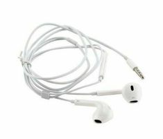 the ear buds are white and have black tips on them, while one is plugged into an ipod charger