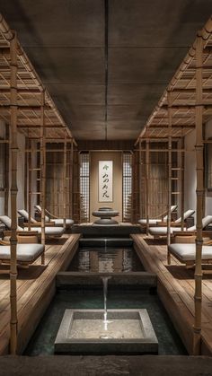 the inside of a japanese style spa with water running from it's center pond