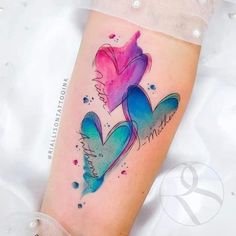 a colorful tattoo with two hearts on it