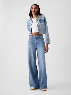 Fit:  A full-length, supersoft baggy jean that's fitted on the waist & relaxed all the way down.  ​ Fabric:  55% Cotton, 40% Tencel, 5% Recycled Cotton.  Stretch: No Stretch Jeans.  Authentic denim that gets better with every wear.  Made to wear all day & break in over time.  ​ Rise :  Mid Rise Jeans.  Look: A five-pocket baggy jean in a light or medium indigo wash.  ​ Details:  Zip fly & five-pocket styling.  Responsibly Made: This pair of denim is part of our water-saving Washwell program.  Compared with conventional wash methods, Washwell uses at least 20% less water and has saved over a billion liters of water since 2016.  Our Mid Rise Jean has a 10" 25 cm) rise. ​ Fitted at the waist and hip.  Loose, baggy through the leg.  Full-length jean.  Hits below the ankle. ​ 26" 66 cm) leg ope Style Wide Leg Jeans, Wide Legged Jeans, Baggy Jean, Jeans Look, Bdg Jeans, Winter Jeans, Wide Jeans, Break In, Women Denim Jeans