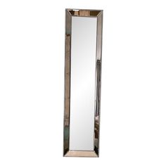 a tall mirror sitting on top of a white wall