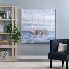 a living room with a chair, book shelf and painting on the wall above it