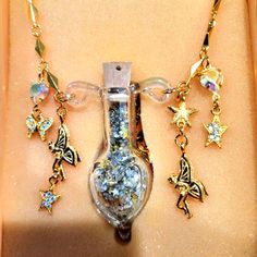 Vintage Kirks Folly Vial Fairy Dust Necklace Rare, Htf! Vial Of Magic Fairy Dust Is Encased In An Ornate Glass Enclosure, Complete With A Cork Stopper. The Vessel Hangs Securely, And Is 3" Long. Gorgeous Chain That Is 36" Long, No Extender. Hanging From Each Side Are Golden Faries, Butterflies, And Hearts With Inlaid Pave Aurora Borealis Crystals. Goldtone, With Glass. Fairy Dust In Various Shapes With Multi-Colored Glitter. This Is Vintage, Very Hard To Find "Collector Item" That Will Be Treasu Fairy Dust Necklace, Kirks Folly Jewelry, Glass Fairy, Dragon Glass, Magic Fairy, Vial Necklace, Magnetic Necklace, Star Necklace Gold, Kirks Folly