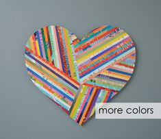 a heart made out of strips of colored paper with the words more colors on it