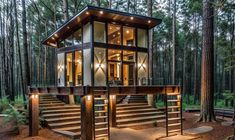 a small cabin in the woods with stairs leading up to it's second floor