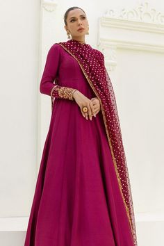 Maroon silk long Designer Anarkali Gown. This ensemble effortlessly combines traditional charm with contemporary flair, making it a perfect choice for women and girls who appreciate timeless elegance. The ensemble is paired with a stylish sequin embellished long dupatta that not only enhances the overall look but also adds a layer of sophistication. The dupatta features intricate detailing, showcasing expert craftsmanship and attention to detail. Whether you're attending a wedding, a festive cel Luxury Mulmul Anarkali Salwar Kameez, Luxury Anarkali Salwar Kameez For Celebration, Luxury Anarkali Unstitched Suit With Dabka, Luxury Anarkali Salwar Kameez For Festivals, Luxury Anarkali Traditional Wear With Gota Work, Luxury Anarkali Salwar Kameez With Mirror Work, Luxury Anarkali Katan Silk Salwar Kameez, Luxury Jamawar Anarkali Set For Eid, Luxury Cutdana Anarkali Set For Eid