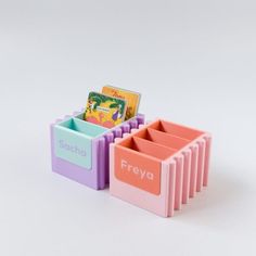 there are several different colored plastic containers with books in each one, and the word freva is written on them