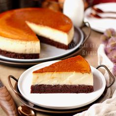 two plates with slices of cheesecake on them