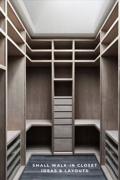 an empty walk in closet with shelves and drawers