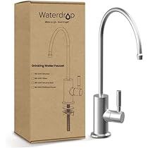 the new waterco kitchen faucet is in its box and next to it's packaging