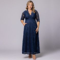 The Maria Lace Evening Gown is the epitome of elegance and sophistication. This stunning long formal gown is available exclusively in women’s plus sizes, and crafted from stretch floral lace. The flattering A-line silhouette, surplice neckline, and scalloped lace details add a classic touch of femininity, while pockets offer practicality for a seamless evening. Perfect for weddings, galas, formal events, and any special occasion, this gown is a must-have for the mother of the bride or groom or a Jumpsuit And Cardigan, Chic Cardigan, Long Formal Gowns, Lace Evening Gowns, Seam Allowance, Evening Gown Dresses, Black Tie Wedding, Surplice Neckline, Formal Gown