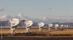 several large array of satellite dishes in the desert