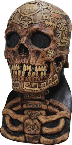 a carved skull with intricate designs on it's face