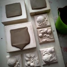 there are many clay molds on the table