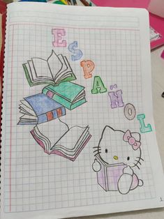 a notebook with hello kitty and books on it