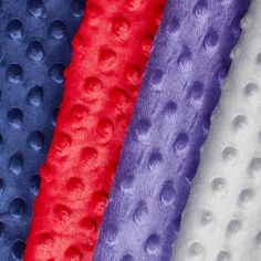 four different colors of fabric with circles on them and one is red, white, blue, and purple