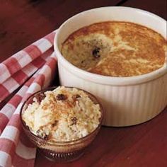 a casserole dish with mashed potatoes and raisins on the side