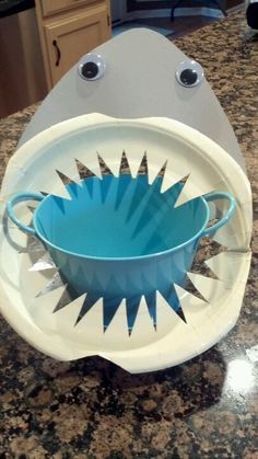 a blue and white bowl sitting on top of a counter