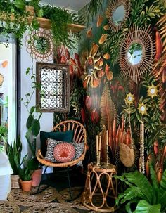 a room filled with lots of plants next to a wall covered in pictures and mirrors