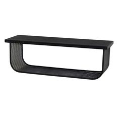 a black shelf sitting on top of a white wall in front of a white background