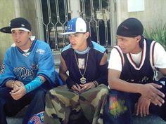 three young men sitting next to each other