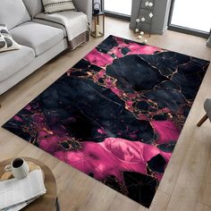 a living room area rug with black, pink and gold marble design on the floor