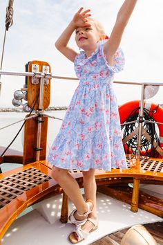 Introducing the Mini Marjorie Dress, the ultimate summer dress for your littles! Say hello to a sea of whimsical blue, white, & red butterfly prints, on a soft cotton fabric. Its neckline is surrounded by a cascade of ruffles, perfectly complementing the flutter sleeves. But wait, there's more! Made to capture the perfect family photo this summer with your little in the Mini Marjorie Dress! Don't forget the matching adult styles! Butterfly Prints, Cotton Short Dresses, Red Butterfly, Perfect Family, City Girl, A Sea, Flutter Sleeves, Butterfly Print, Family Photo