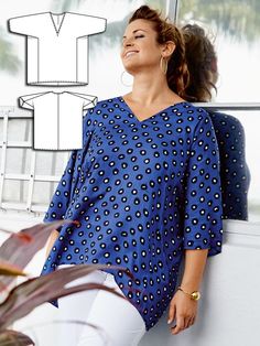 a woman leaning against a wall next to a plant and paper cut out of her shirt