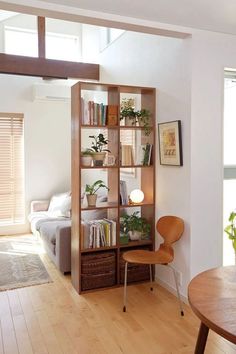 a living room filled with furniture and a wooden table