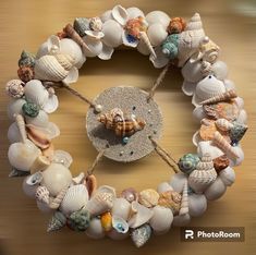 there is a clock made out of seashells