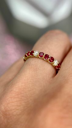 DETAILS: * Handmade item * Gemstone: Ruby, Natural Diamond * Gem color: Red * Band color: Yellow Gold (may vary on gold selection) * Condition: Never been Used; Made to order, Recycled Metal, Conflict-free 100% DESCRIPTION: 💎 Welcome to the Our Shop, Congratulations🍾 on discovering us. 💎 You'll be amazed at the beauty and delicate craftsmanship of this ring. This custom 18-karat gold stacking eternity ring features alternating 3 round rubies sitting side-by-side with one white diamond in a sh Elegant Ruby Ring, Ruby Diamond Eternity Band, Ruby And Sapphire Rings, Ruby And Diamond Eternity Ring, Ruby Anniversary Ring, Diamond Ruby Ring, Diamond And Ruby Rings, Ruby And Gold Ring, Ruby And Diamond Wedding Band