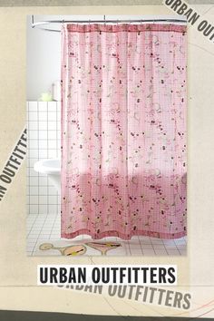 a pink shower curtain with flowers on it