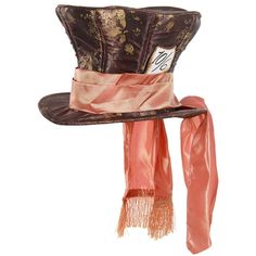 a brown hat with a pink scarf around it's neck and a tag on the top