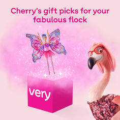 a pink box with a fairy on it and a flamingo standing next to it