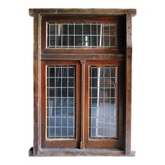 an old wooden window with glass panes on the top and bottom windows above it