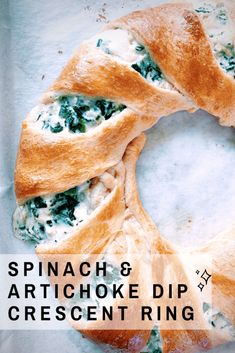 spinach and artichoke dip crescent ring with text overlay reading spinach & artichoke dip crescent ring