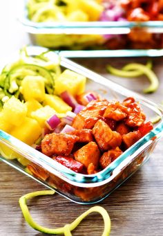 there are many different types of food in the container on the table, including meats and veggies