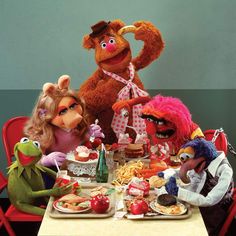 the muppets are having a meal together