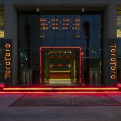 an entrance to a building with neon lights