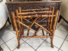 a small wooden table with a book on it