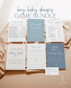 the baby shower game bundle is laid out on top of a bed with sheets and pillows