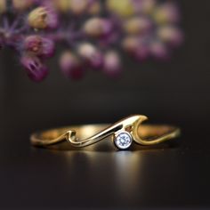 "A perfect gift for an ocean lover, this gorgeous yet simple wave ring is crafted in 14k gold. It has 2 crests giving it a natural wave effect. * Diamond Wt. : 0.02 Cts * Color-Clarity Grade : H-I, Vs-Si * Gold - 14kt, 1.2 gms solid gold If you like this ring, please press \"Pin it\" button on the right of your screen. Find us on Instagram for exquisite designs: @abhikajewels Like us on Facebook: www.facebook.com/Abhikajewels Thank you for visiting our shop.. :D <3" Tropical Wedding Rings, Ocean Wave Ring, Wave Diamond Ring, Diamond Wave Ring, Wave Wedding Ring, Ocean Themed Engagement Rings, Ocean Inspired Ring, Ocean Wedding Ring, Ocean Engagement Ring